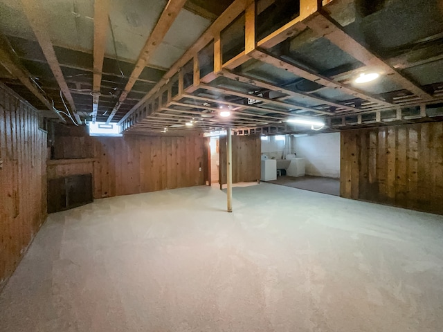 basement featuring washing machine and clothes dryer