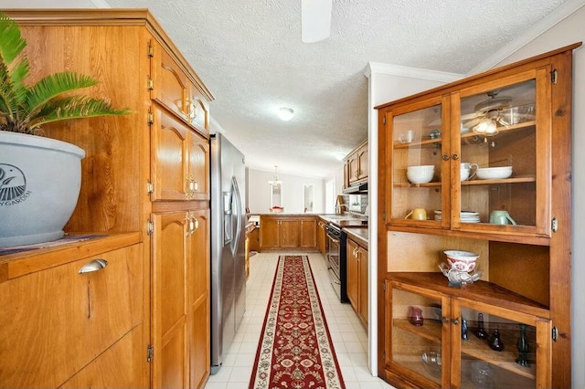 kitchen with electric range, stainless steel fridge, crown molding, a textured ceiling, and vaulted ceiling