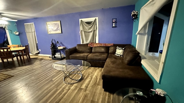 living room with hardwood / wood-style flooring and ceiling fan