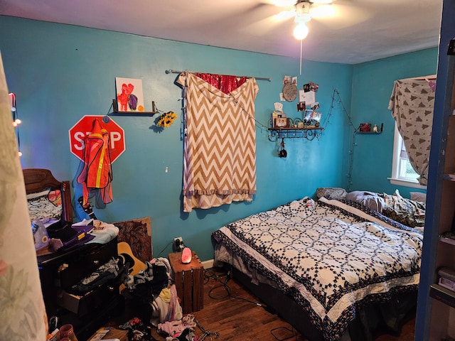 bedroom with hardwood / wood-style flooring and ceiling fan