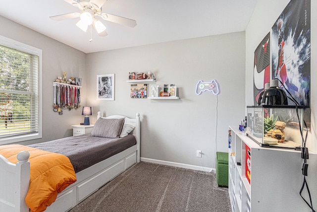 carpeted bedroom with ceiling fan and multiple windows