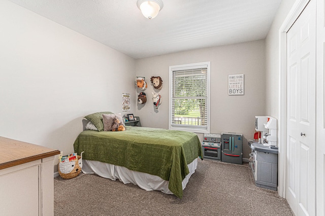 bedroom featuring a closet and carpet floors