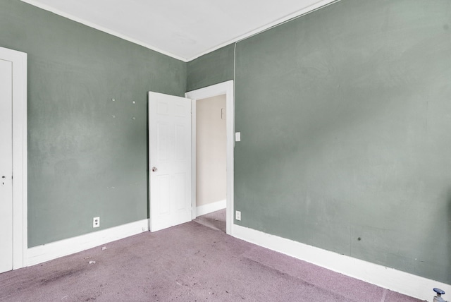 spare room featuring carpet floors