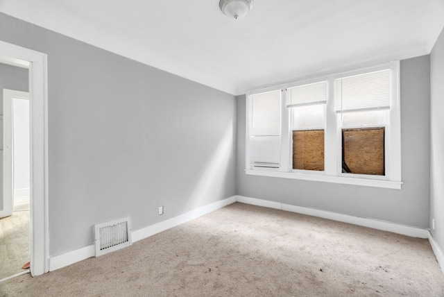 empty room featuring carpet floors