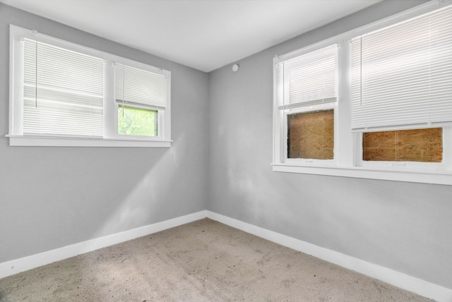 unfurnished room featuring carpet