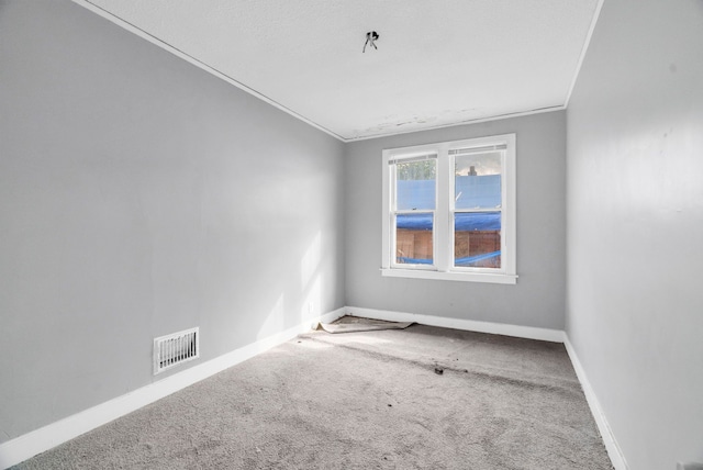 carpeted empty room with ornamental molding