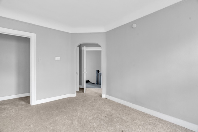 spare room with light colored carpet