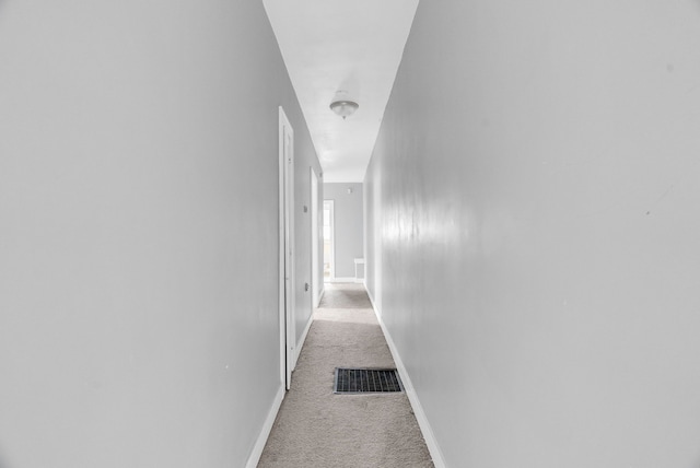 corridor with light carpet