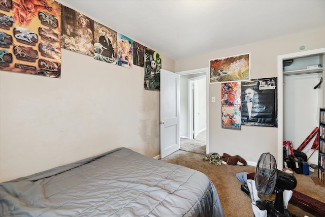 bedroom featuring light carpet and a closet