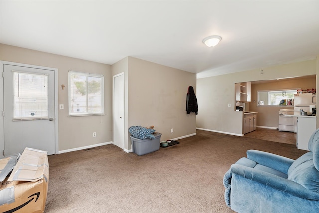 living room with dark carpet