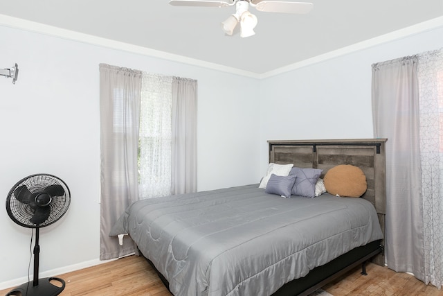 bedroom featuring hardwood / wood-style flooring and ceiling fan