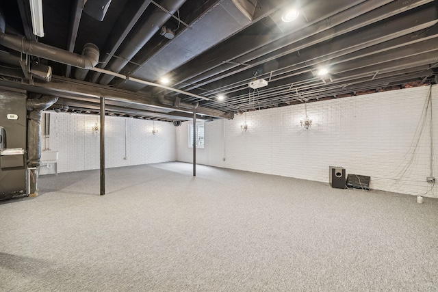 basement with sink and brick wall