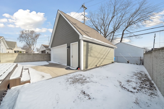 view of snow covered garage