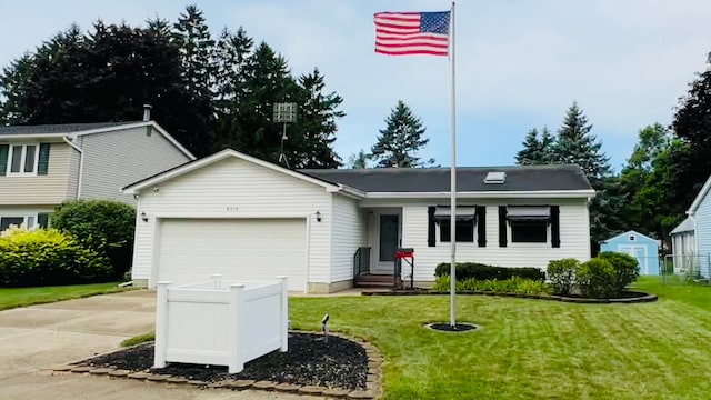 view of front facade featuring a garage and a front yard