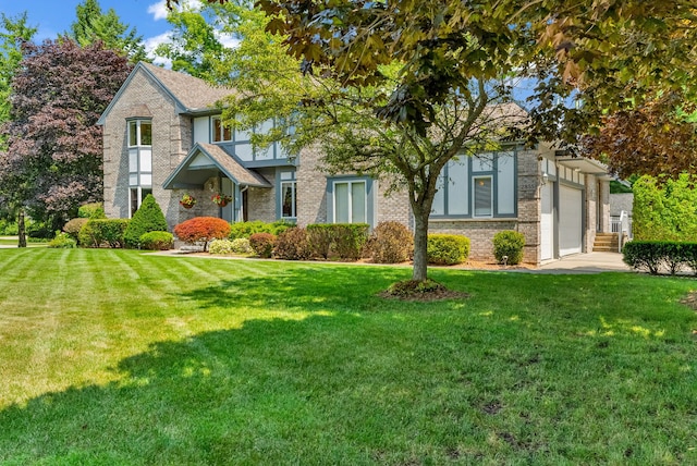 view of front facade featuring a front lawn and a garage