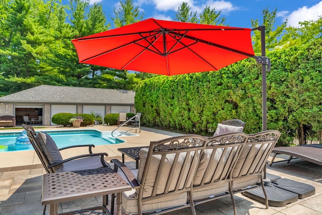 view of swimming pool featuring a patio and an outdoor living space