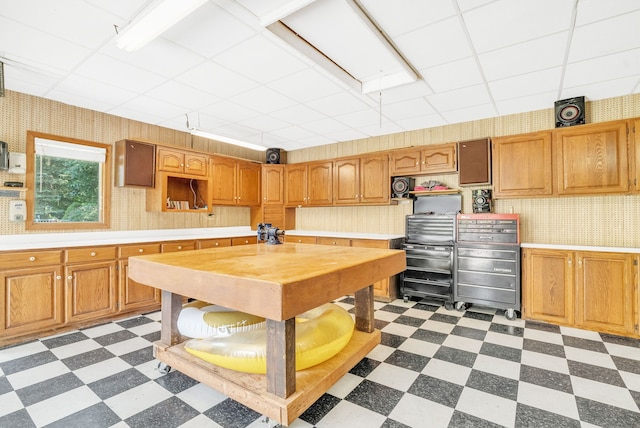 kitchen featuring a drop ceiling