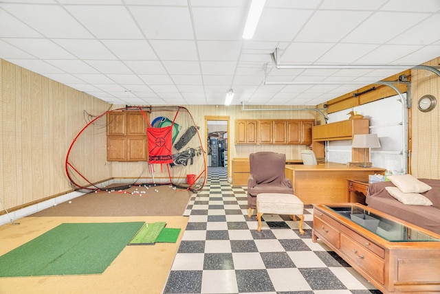 basement featuring a drop ceiling