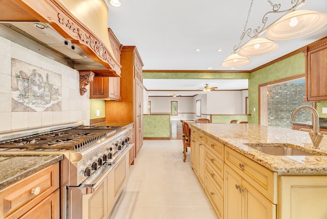 kitchen with range with two ovens, custom exhaust hood, tasteful backsplash, ceiling fan, and sink