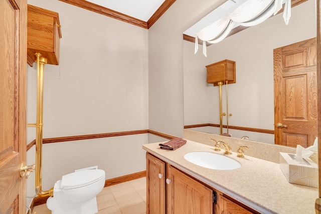 bathroom with toilet, vanity, tile patterned floors, and ornamental molding