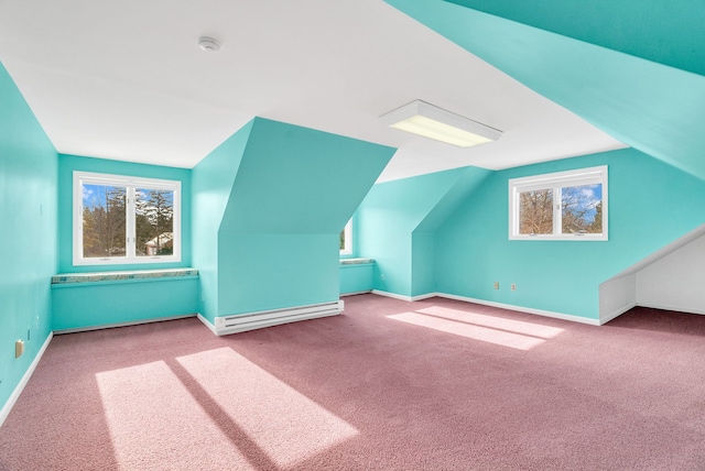 bonus room with light carpet, vaulted ceiling, and a baseboard radiator