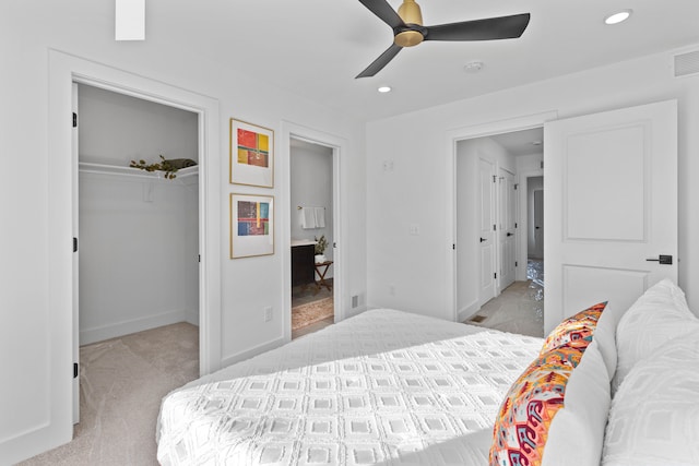 carpeted bedroom with ceiling fan and a closet