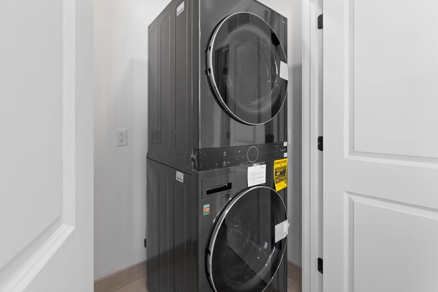 laundry room featuring stacked washing maching and dryer