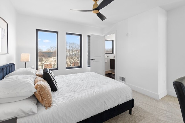 bedroom with light colored carpet and ceiling fan