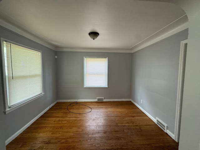 unfurnished room featuring dark hardwood / wood-style floors