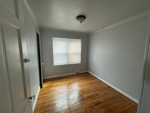 spare room with light hardwood / wood-style flooring