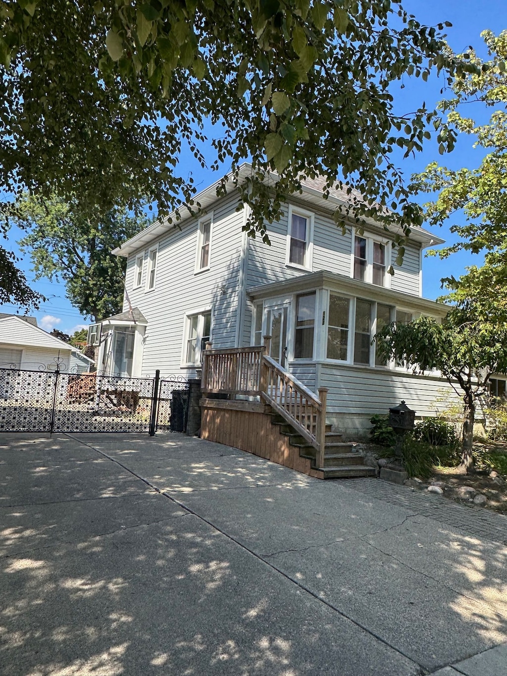 view of front of property with a sunroom