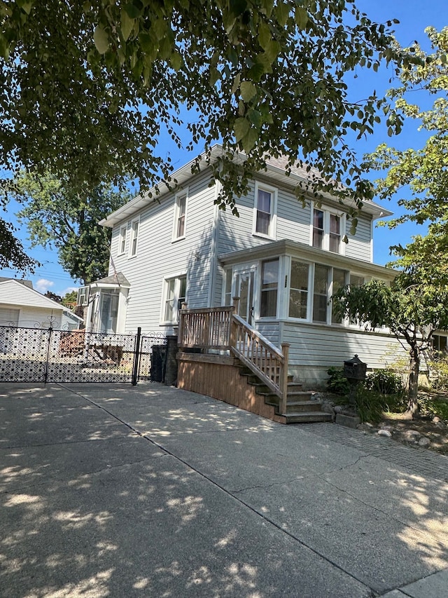 view of front of property with a sunroom