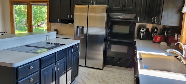 kitchen featuring sink and black appliances