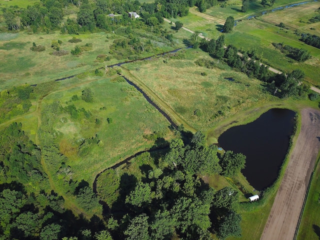 birds eye view of property featuring a water view and a rural view