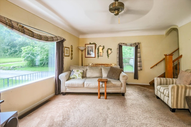 living room with carpet floors and ceiling fan