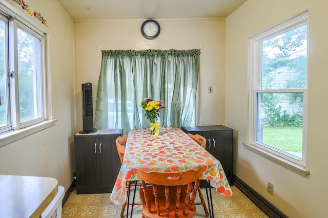 tiled dining space featuring a wealth of natural light