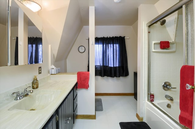 bathroom with vanity and combined bath / shower with glass door