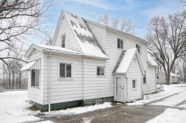 view of snow covered house