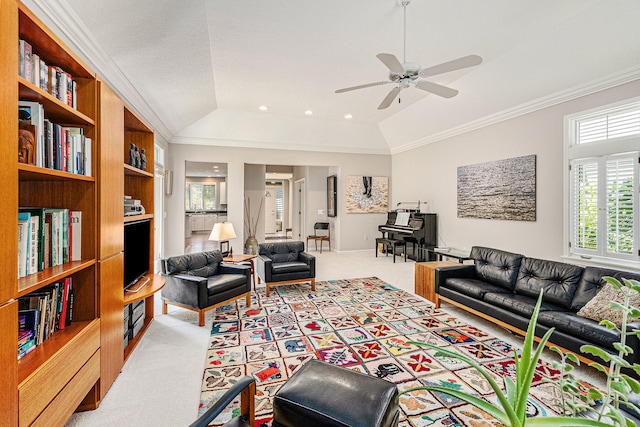 living room with vaulted ceiling, light colored carpet, crown molding, and ceiling fan