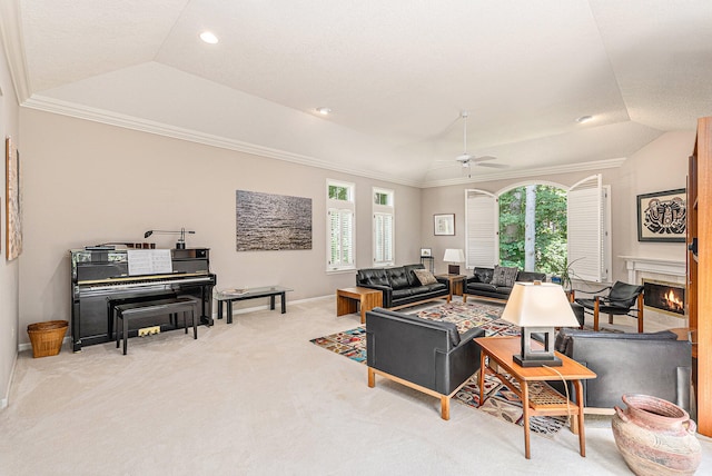 living room with vaulted ceiling, a healthy amount of sunlight, light colored carpet, and ceiling fan