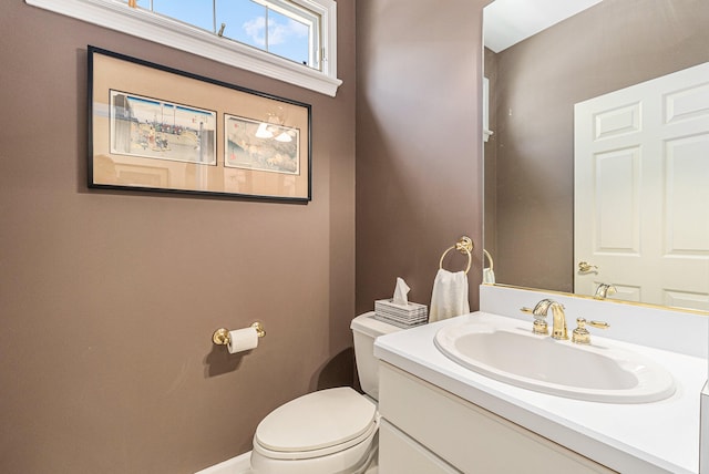 bathroom with toilet and vanity