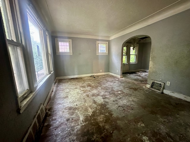 empty room featuring a textured ceiling