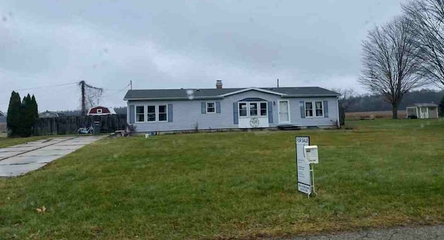 23316 N Shore Dr, Edwardsburg, MI 49112 - view of front facade with a front lawn