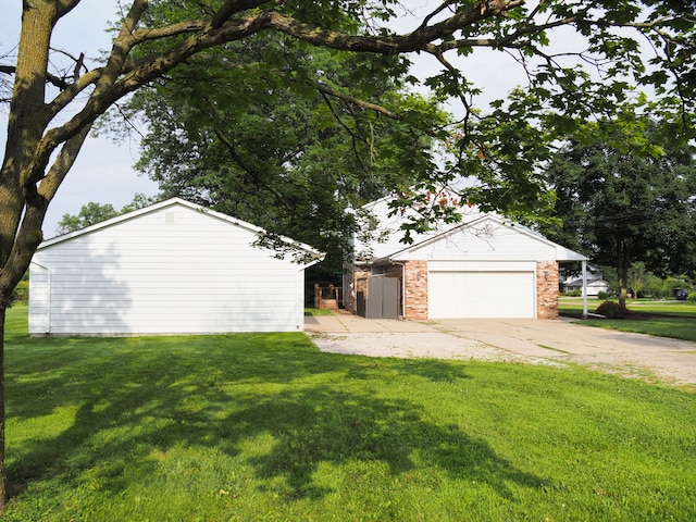 exterior space featuring a yard and a garage