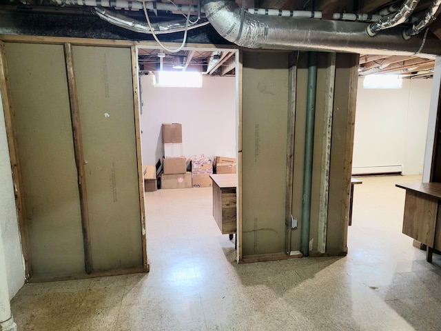 basement with a baseboard heating unit