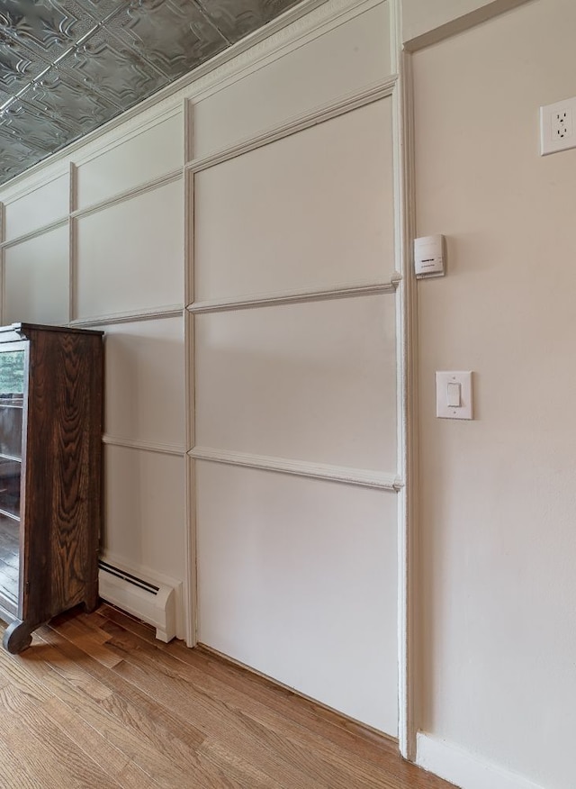 closet featuring baseboard heating