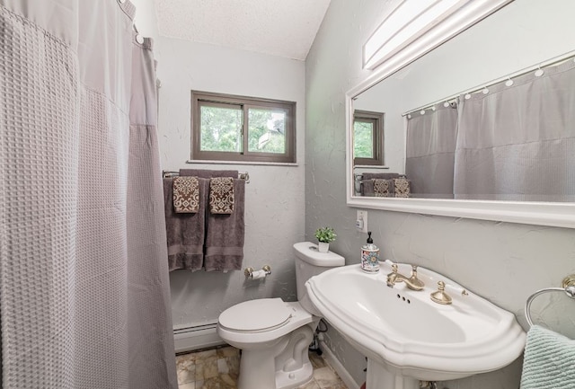 bathroom featuring curtained shower, sink, a baseboard radiator, a textured ceiling, and toilet