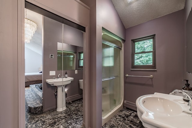 bathroom featuring sink, walk in shower, a baseboard heating unit, a textured ceiling, and vaulted ceiling