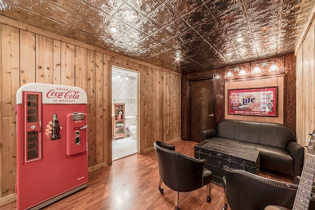 interior space with wood-type flooring and wooden walls