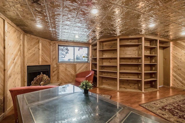 wine cellar featuring wood walls and hardwood / wood-style flooring